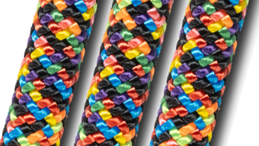 Close-up of colorful braided rope pattern with vibrant hues of red, blue, yellow, green, orange, black, and purple.