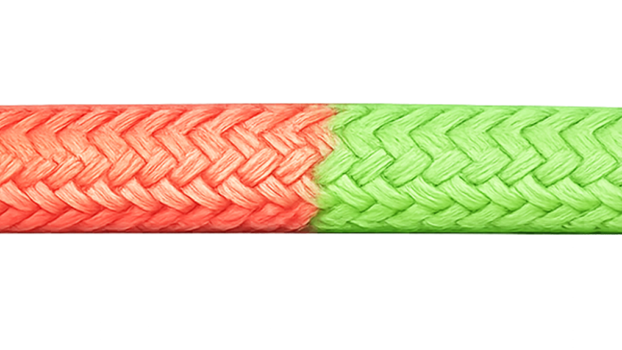 Close-up of a braided rope with a red and green section, showcasing its intricate woven pattern.